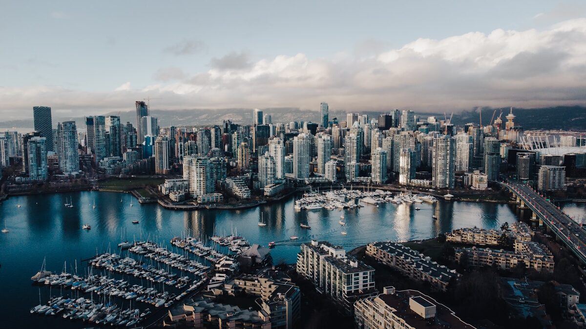 Immigrate to Alberta: energy, technology and cost of living View of downtown Calgary, Alberta with the Rocky Mountains in the background at sunset