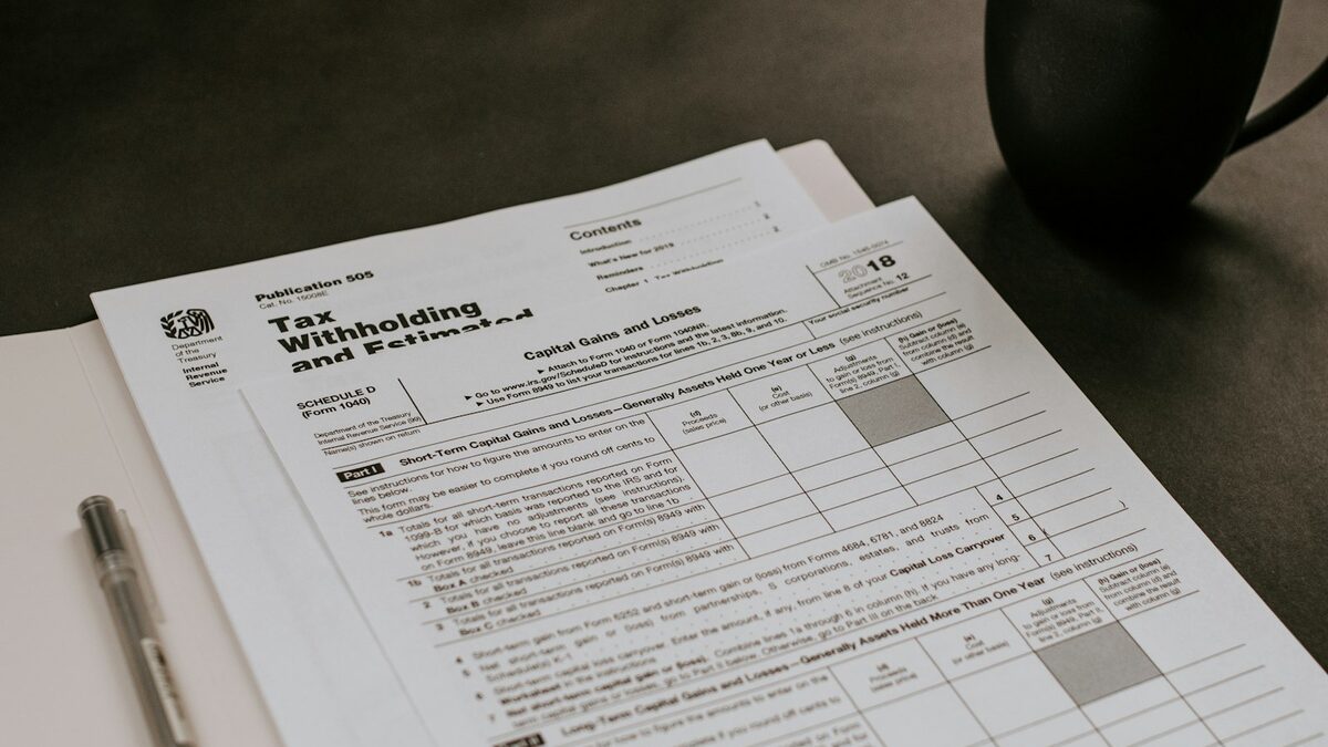Cost of living in Canada: planning your budget before you arrive Open budget notebook on a table beside a cup of coffee, planning a move to Canada